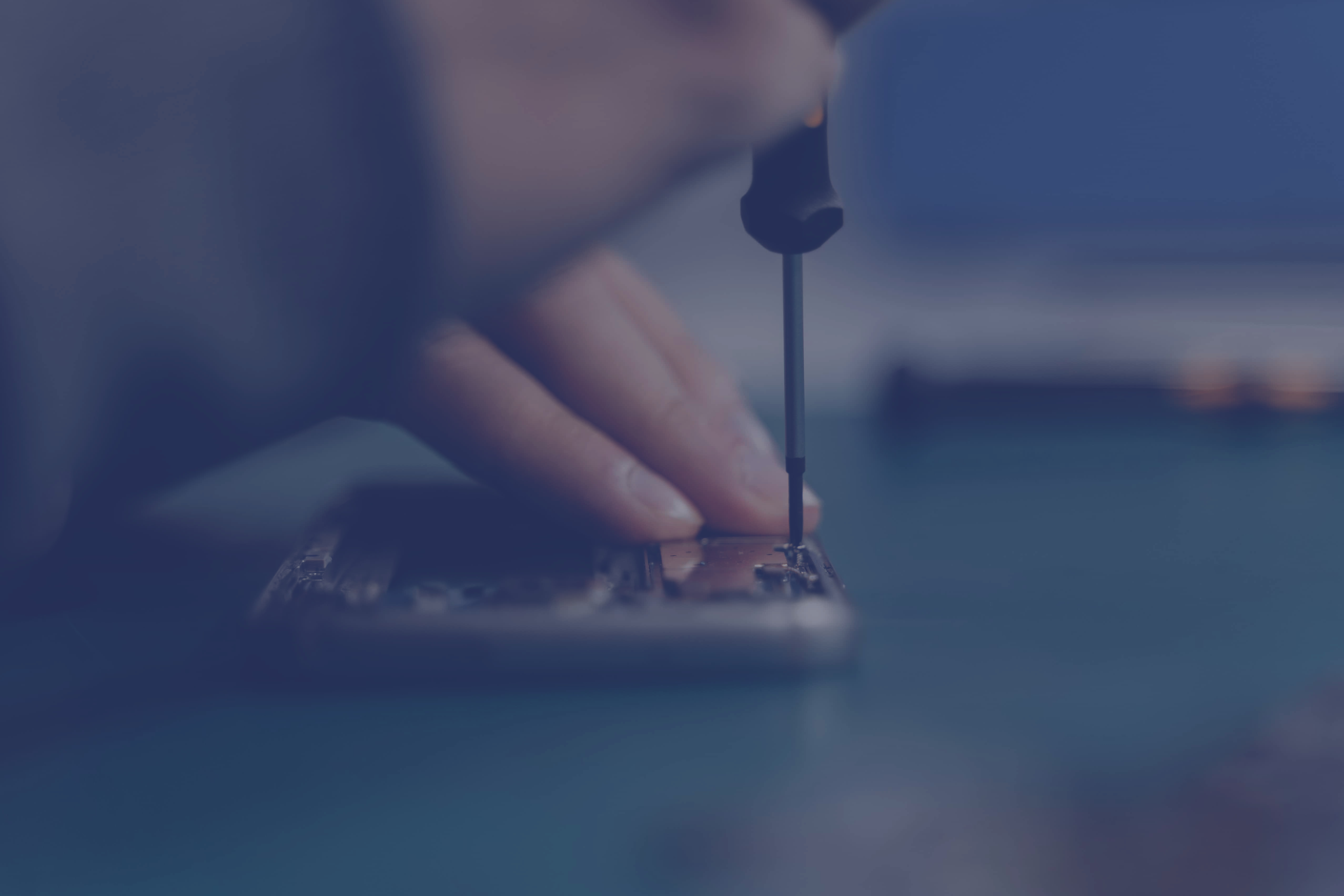 A phone screen being repaired.
